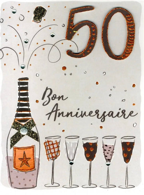 Carte d’anniversaire 50 ans illustrée d’une bouteille de champagne et de flûtes festives, avec l’inscription « Bon Anniversaire », format 9 x 12 pouces.